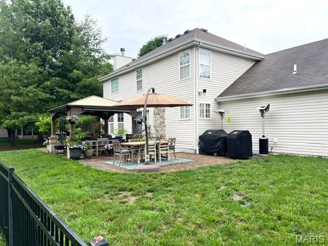 2235 Arnold Palmer Dr, Belleville, IL 62220 - rear view of property with a gazebo, a patio area, and a chimney