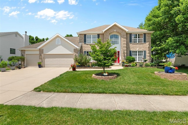 2235 Arnold Palmer Dr, Belleville, IL 62220 - colonial house featuring an attached garage, concrete driveway, brick siding, and a front lawn