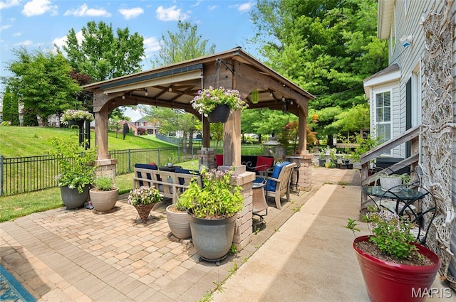 2235 Arnold Palmer Dr, Belleville, IL 62220 - fenced backyard featuring a gazebo, a patio, and an outdoor hangout area