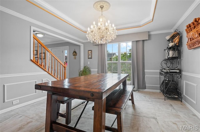 2235 Arnold Palmer Dr, Belleville, IL 62220 - dining area featuring a chandelier, stairs, ornamental molding, a raised ceiling, and wainscoting