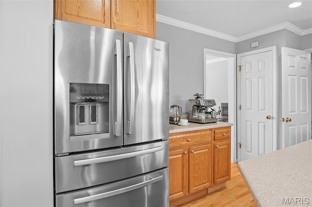 2235 Arnold Palmer Dr, Belleville, IL 62220 - kitchen featuring stainless steel fridge, light wood-type flooring, light countertops, and crown molding