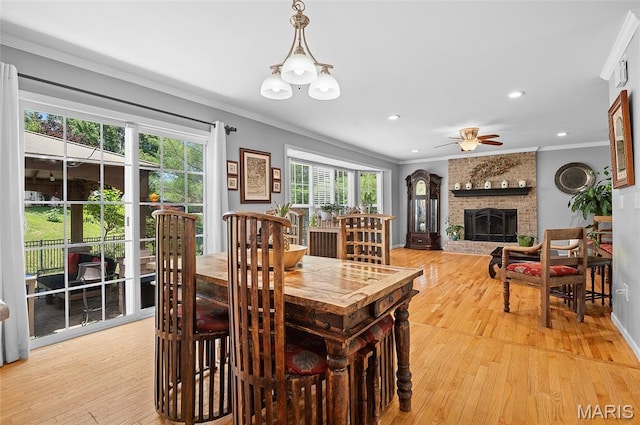 2235 Arnold Palmer Dr, Belleville, IL 62220 - dining space featuring ornamental molding, a fireplace, a ceiling fan, light wood-style floors, and recessed lighting