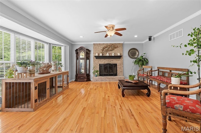 2235 Arnold Palmer Dr, Belleville, IL 62220 - living room with wood finished floors, a ceiling fan, crown molding, a fireplace, and recessed lighting