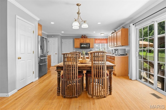 2235 Arnold Palmer Dr, Belleville, IL 62220 - dining room featuring ornamental molding, healthy amount of natural light, light wood-type flooring, and recessed lighting