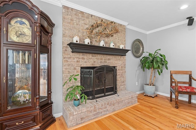 2235 Arnold Palmer Dr, Belleville, IL 62220 - living room featuring wood finished floors, a brick fireplace, and ornamental molding