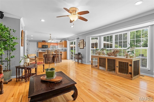 2235 Arnold Palmer Dr, Belleville, IL 62220 - living room with ornamental molding, ceiling fan, recessed lighting, a chandelier, and healthy amount of natural light