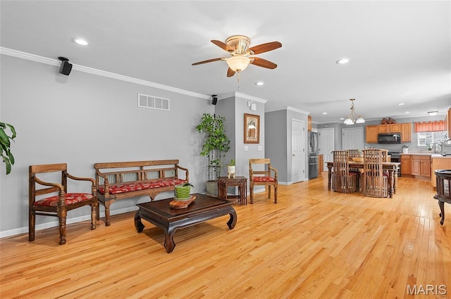 2235 Arnold Palmer Dr, Belleville, IL 62220 - living area featuring ceiling fan, recessed lighting, crown molding, and light wood-style floors