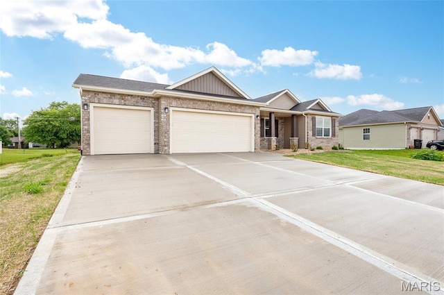 225 Ranchero Dr, Hamel, IL 62046 - view of front of home with a garage, a front yard, driveway, and brick siding