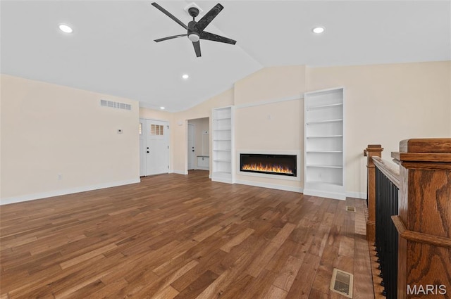 225 Ranchero Dr, Hamel, IL 62046 - unfurnished living room featuring ceiling fan, wood finished floors, vaulted ceiling, a glass covered fireplace, and recessed lighting