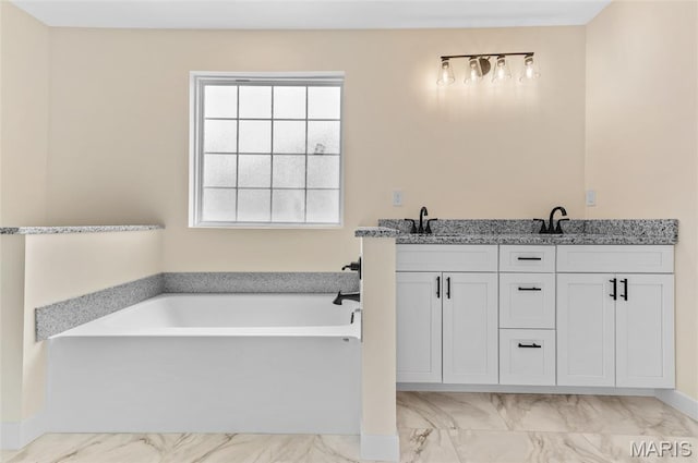 225 Ranchero Dr, Hamel, IL 62046 - full bathroom featuring marble look tile flooring, a garden tub, and double vanity