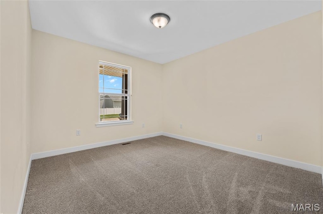 225 Ranchero Dr, Hamel, IL 62046 - spare room featuring carpet floors and baseboards