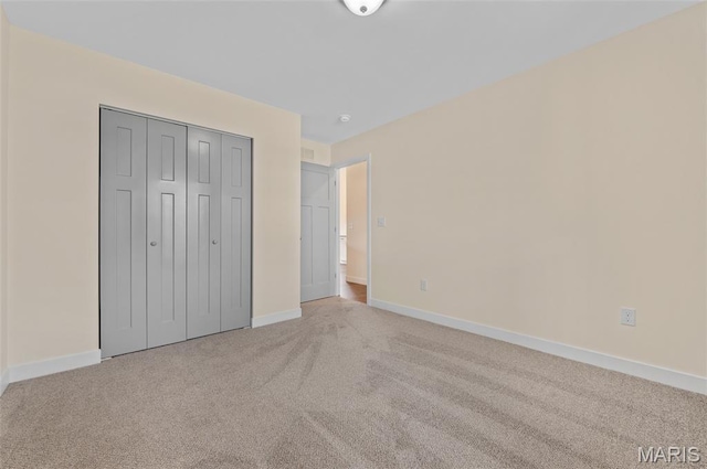 225 Ranchero Dr, Hamel, IL 62046 - unfurnished bedroom with light colored carpet and a closet