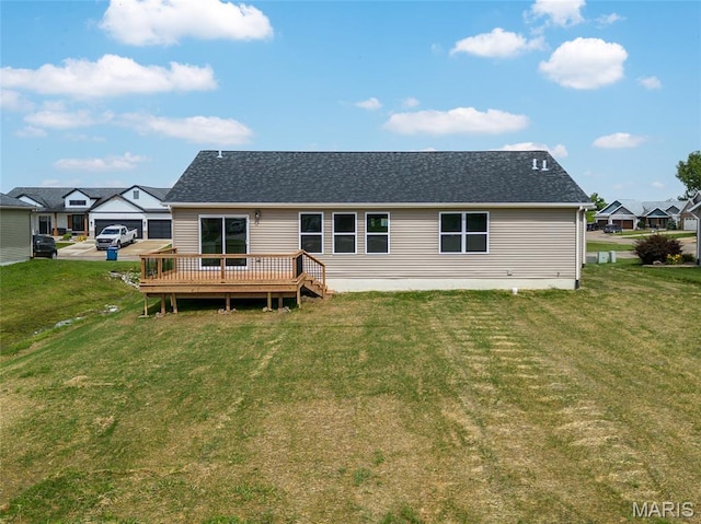 225 Ranchero Dr, Hamel, IL 62046 - back of house with a lawn, a wooden deck, and roof with shingles