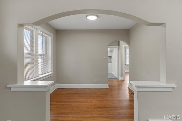 3800 Oakridge Blvd, Northwoods, MO 63121 - corridor with arched walkways and wood finished floors