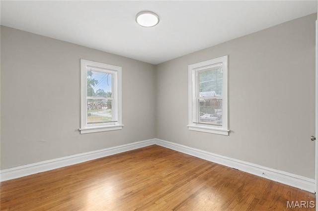 3800 Oakridge Blvd, Northwoods, MO 63121 - spare room featuring wood finished floors and baseboards