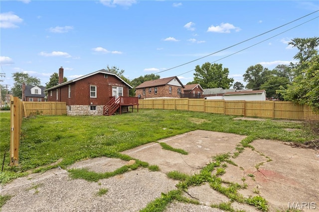 3800 Oakridge Blvd, Northwoods, MO 63121 - fenced backyard with stairs and a deck