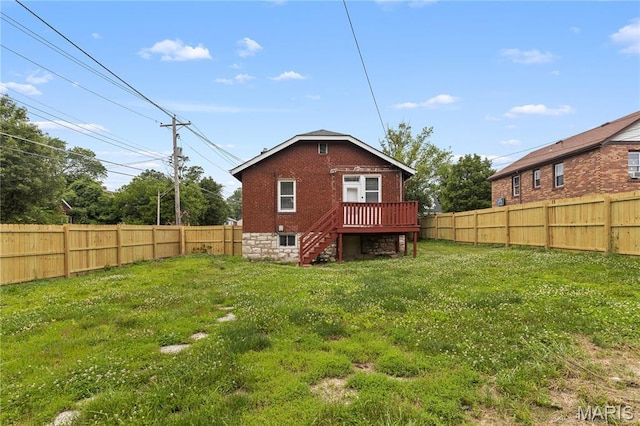 3800 Oakridge Blvd, Northwoods, MO 63121 - rear view of property featuring brick siding, a fenced backyard, stairway, and a deck