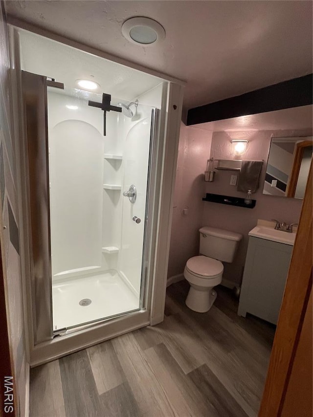 2319 Hickory St Unit A, Saint Louis, MO 63104 - bathroom with a shower stall, wood finished floors, and vanity