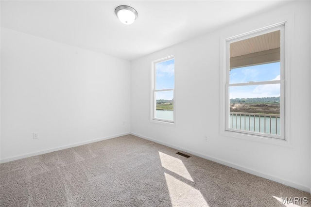 3059 Pirogue St, Saint Charles, MO 63301 - carpeted empty room with baseboards and a water view