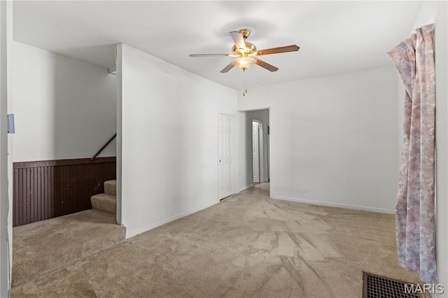 224 E Velma Ave, Lemay Township, MO 63125 - spare room featuring carpet, ceiling fan, and stairway