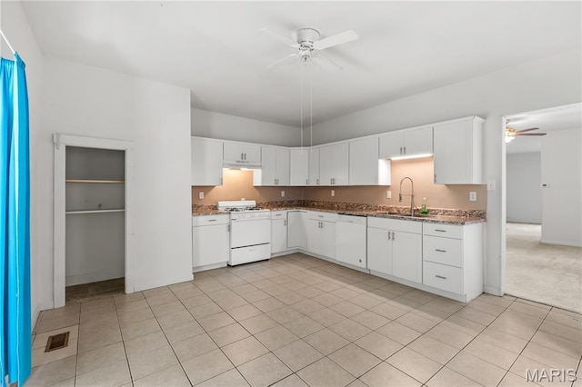 224 E Velma Ave, Lemay Township, MO 63125 - kitchen with ceiling fan, white appliances, under cabinet range hood, and dark stone countertops