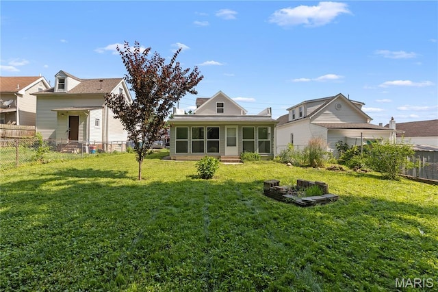224 E Velma Ave, Lemay Township, MO 63125 - back of property featuring a sunroom and a fenced backyard
