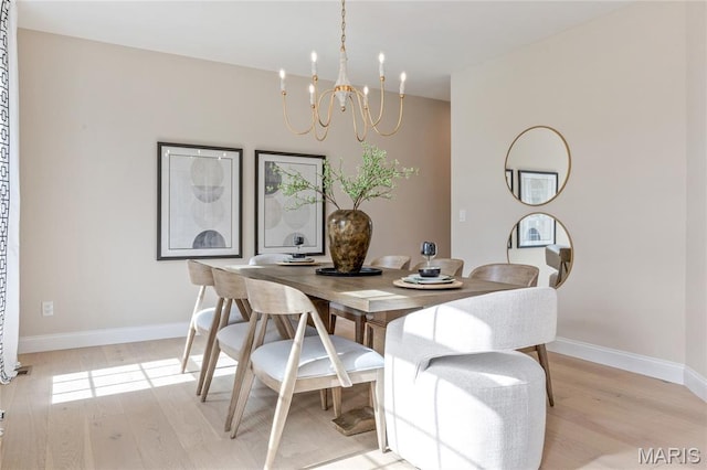 851 Whitmoor Dr, Weldon Spring, MO 63304 - dining area with light wood-style floors and a chandelier