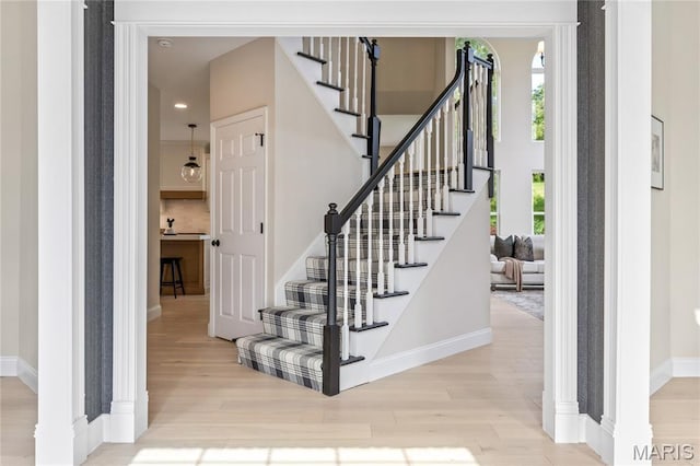 851 Whitmoor Dr, Weldon Spring, MO 63304 - staircase featuring wood finished floors and recessed lighting