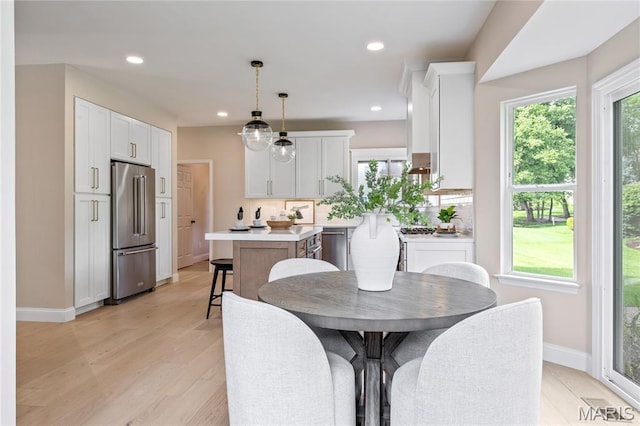 851 Whitmoor Dr, Weldon Spring, MO 63304 - dining space with healthy amount of natural light, recessed lighting, and light wood-type flooring