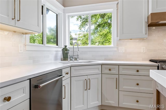 851 Whitmoor Dr, Weldon Spring, MO 63304 - kitchen with dishwasher, decorative backsplash, light countertops, and wall chimney range hood
