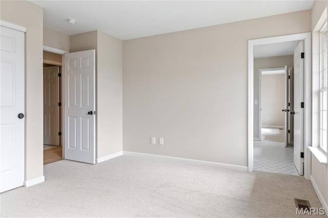 851 Whitmoor Dr, Weldon Spring, MO 63304 - unfurnished bedroom featuring carpet and multiple windows