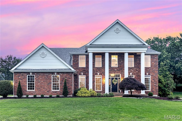 851 Whitmoor Dr, Weldon Spring, MO 63304 - greek revival inspired property featuring a lawn, brick siding, and a shingled roof