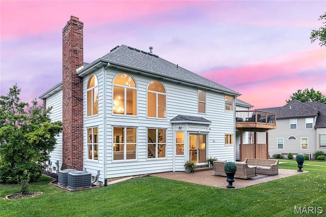 851 Whitmoor Dr, Weldon Spring, MO 63304 - rear view of house featuring an outdoor hangout area, a yard, a patio area, a chimney, and a shingled roof