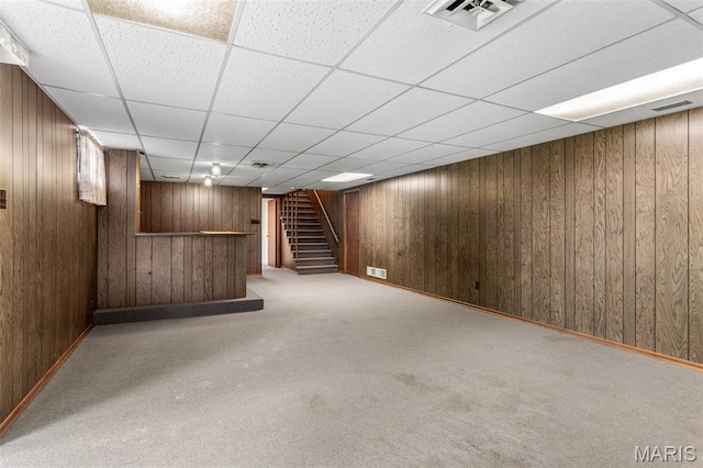 2844 Deborah Ann Dr, Arnold, MO 63010 - finished below grade area with a bar, carpet floors, stairway, wood walls, and a paneled ceiling
