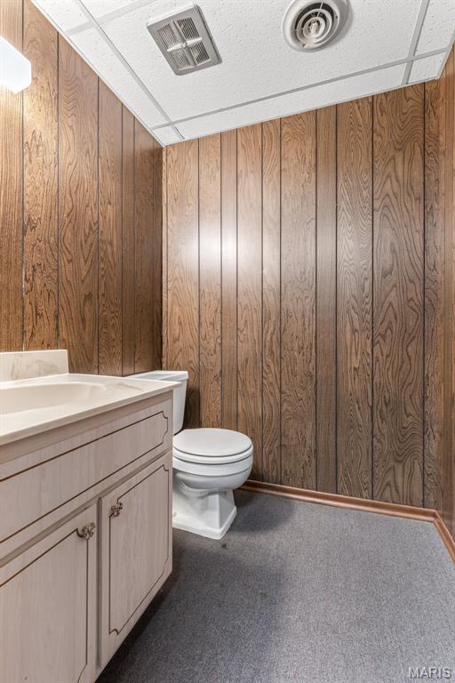 2844 Deborah Ann Dr, Arnold, MO 63010 - half bathroom featuring vanity and wood walls