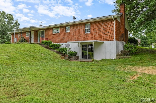2844 Deborah Ann Dr, Arnold, MO 63010 - rear view of house featuring a chimney and brick siding