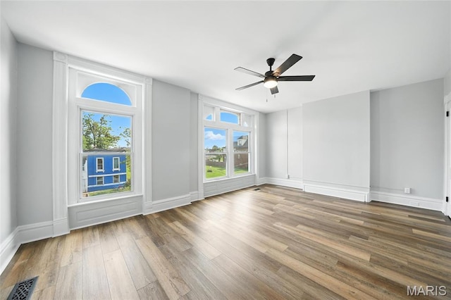 4550 Enright Ave, Saint Louis, MO 63108 - unfurnished room with wood finished floors and ceiling fan