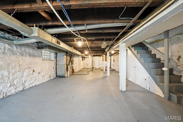 4550 Enright Ave, Saint Louis, MO 63108 - unfinished basement featuring heating unit and stairway