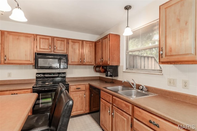 18 Novella Dr, Saint Peters, MO 63376 - kitchen featuring black appliances, tasteful backsplash, pendant lighting, and light flooring