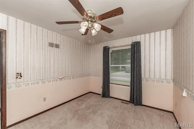18 Novella Dr, Saint Peters, MO 63376 - carpeted spare room with wallpapered walls and ceiling fan