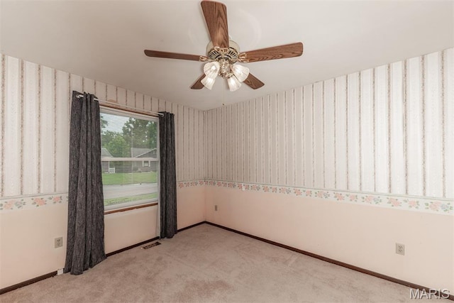 18 Novella Dr, Saint Peters, MO 63376 - spare room featuring light carpet, wallpapered walls, and a ceiling fan