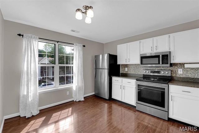 800 Sugar Valley Ct Unit A, Saint Peters, MO 63376 - kitchen with appliances with stainless steel finishes, dark countertops, tasteful backsplash, and white cabinets