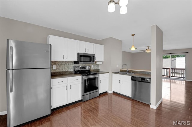 800 Sugar Valley Ct Unit A, Saint Peters, MO 63376 - kitchen with stainless steel appliances, dark countertops, ceiling fan, and dark wood-style flooring