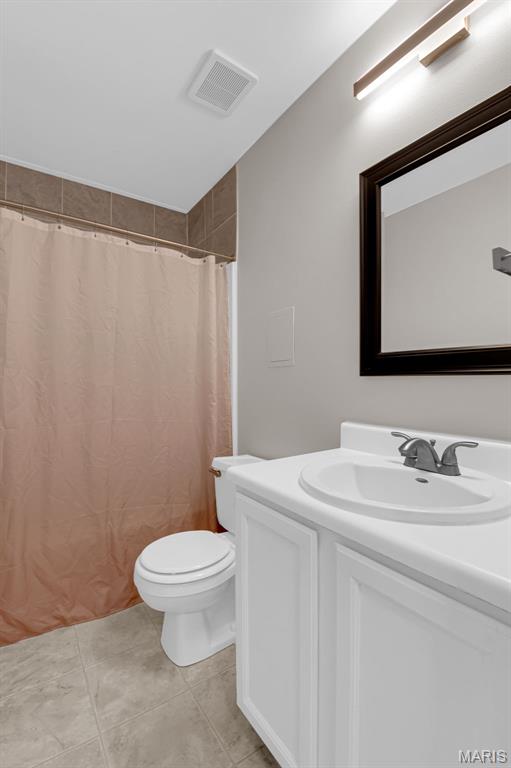 800 Sugar Valley Ct Unit A, Saint Peters, MO 63376 - full bathroom featuring vanity, a shower with curtain, and tile patterned floors