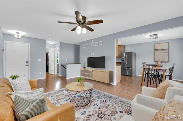 818 Sugar Valley Ct, Saint Peters, MO 63376 - living area with ceiling fan and light wood-style flooring
