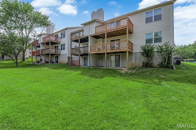 818 Sugar Valley Ct, Saint Peters, MO 63376 - back of property featuring a lawn, a chimney, a deck, and a balcony