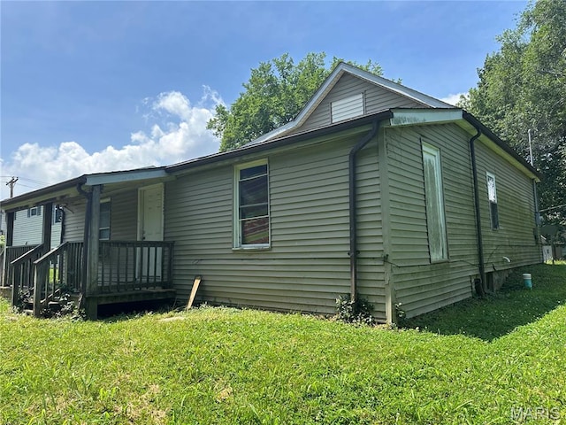 1409 Monroe St, Alton, IL 62002 - view of property exterior featuring a lawn and covered porch