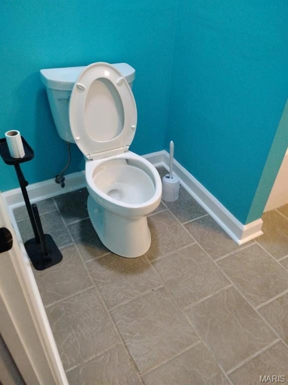 1107 Daffodil St, Sikeston, MO 63801 - bathroom featuring toilet and tile patterned floors