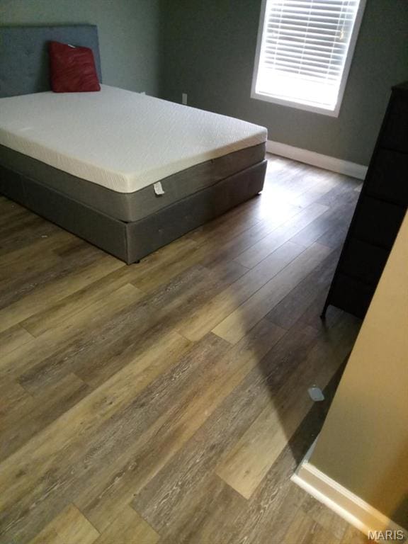 1107 Daffodil St, Sikeston, MO 63801 - bedroom with wood finished floors