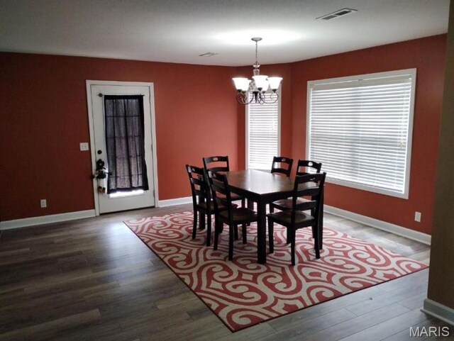 1107 Daffodil St, Sikeston, MO 63801 - dining room featuring a chandelier and wood finished floors